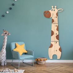 a giraffe height chart on the wall next to a chair