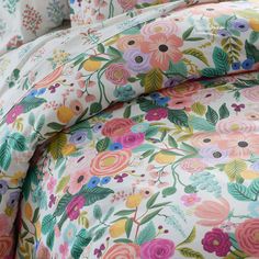 {"A contemporary classic, our Garden Party collection showcases an array of bold, large-scale bouquets and fruits in happy hues of violet, hot pink, apricot, sky blue, magenta, gold and leaf green on a crisp white ground. Play with scale and layer it atop our Hawthorne floral sheets. Our breathable percale bedding collection is an excellent choice for year-round use. Rifle Paper Co. 's hand-painted designs bloom across our premium bedding, with bold colors and florals to bring beauty to your eve Bright Floral Bedroom, Girl Rainbow Room, Blue And Pink Bedroom, Spring Bedding, Percale Bedding, Floral Sheets, Percale Duvet Cover, Best Bed Sheets, College Bedding