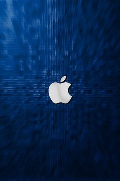 an apple logo is seen in this artistic photo taken from the bottom of a computer screen