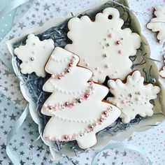 some decorated cookies in a box on a table