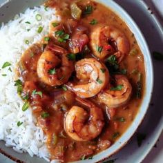 a white plate topped with rice and shrimp