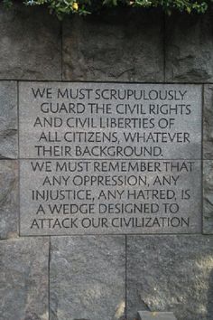 a plaque on the side of a stone wall that reads, we must scruppliously guard the civil rights and civilities of all citizens whatever their background