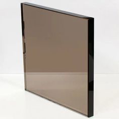 a black and silver glass door on a white surface