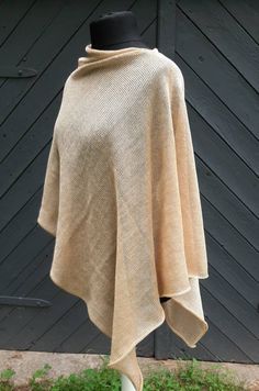 READY TO SHIP Elegant, comfortable, wide knitted natural  linen poncho, shawl wrap. Linen is breathable and most suitable material for the skin. Great accessory for occasions or everyday wearing. Material :  Linen, silk,polyamide. Colour: Beige, Champagne Beige. ONE SIZE. Fits to sizes S,M,L,XL,XXL CARE INSTRUCTION: Gentle cool hand wash +30 C , lay flat on surface to dry.  For more knitted accessories and clothing, visit my shop: https://www.etsy.com/shop/LovesomeKnittings Thank you for shoppin Beige Wrap Shawl One Size, One Size Beige Wrap Shawl, Beige Wrap Shawl, One-size Beige Knit Poncho, Beige Knit Poncho One Size, Beige Knit Poncho, Beige One-size Shawl Wrap, Cozy One Size Poncho For Beach, Beige Shawl Poncho For Beach