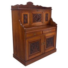 an old fashioned wooden cabinet with carvings on the front and side doors, isolated against a white background