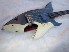 an electric guitar that is shaped like a shark