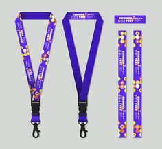 the purple lanyard has flowers on it and is next to other lanyards