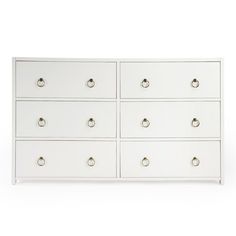 a white dresser with six drawers and two handles