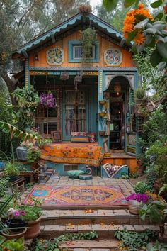 a colorful house is surrounded by plants and flowers