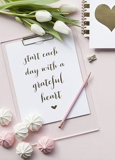 a notepad with the words, start each day with a grateful heart on it