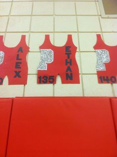 red and white tiles with black letters on them in front of a tiled wall that says pep next to each other