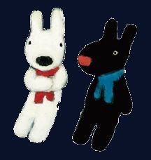 two stuffed animals sitting next to each other on a blue background and one is black