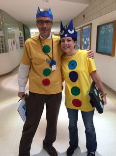 a man and woman dressed up in costumes