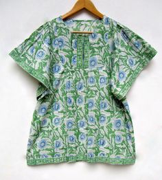 "ITEM DESCRIPTION green blue printed blouse tops - split neckline Indian style blouse - short sleeve blouse Features : short sleeve, Henley neck, Blouse Material : Cotton cambric Fabric: 100% cotton soft light weight ethnic print fabrics Sleeve Length = 9 inch For more sizes & their measurement, please refer our below chart to understand the sizes variations available with us For your size requirement, please mention your size in seller note at the time of buying. IMPORTANT NOTE: - SIZE MEASUREM Green Half Sleeve Tops For The Beach, Green Half-sleeve Top For Vacation, Green Half Sleeve Tops For Vacation, Green Half Sleeve Top For Vacation, Green Half Sleeve Summer Tops, Green Floral Print Short Sleeve Top, Patterned Short Sleeve Blouse For Vacation, Patterned Short Sleeve Blouse For Beach, Patterned Short Sleeve Beach Blouse