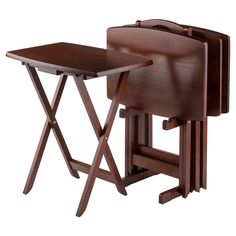 two wooden folding chairs and a table on a white background