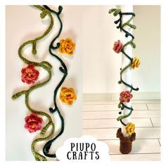 crocheted flowers and vines are hanging on the wall next to a small cactus