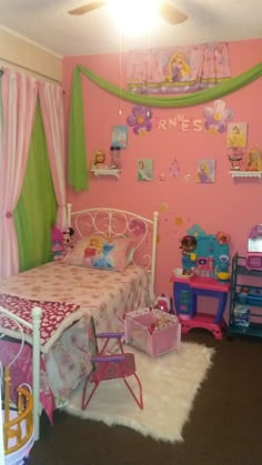 a child's bedroom decorated in pink and green