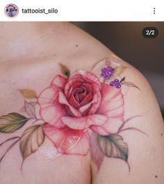 a woman's breast with a rose tattoo on it