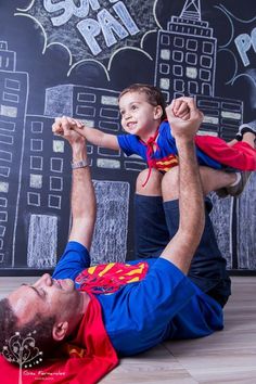 a man holding a little boy on his back