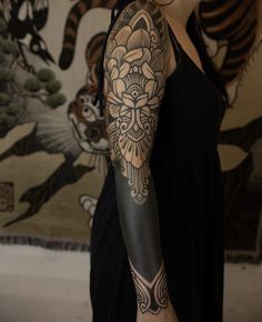 a woman with a tattoo on her arm