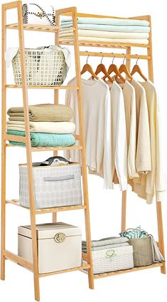 a wooden rack with clothes and baskets on it