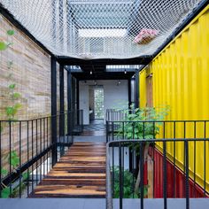 the interior of a building with colorful walls and metal railings on either side of it