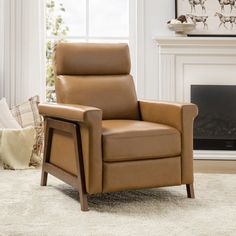 a brown recliner chair sitting in front of a fireplace