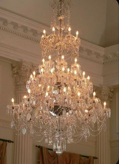 a large crystal chandelier hangs from the ceiling