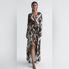 Elevate Occasion Edits With The Snake-Printed Loren, Crafted In A Sweeping Maxi Silhouette With A Front Split That Adds Allure. It Features Long Sleeves With Statement Extended Cuffs, And A Plunging V-Neckline That Further Accentuates The Profile. Add Heels For A Sophisticated Finish. Plunging. V-Neckline. Long Sleeves. Statement Cuffs. Self-Tie Waist. Front Split. Zip Closure To Side. Printed. Lined. Maxi Length. Note:Dress Is Missing Waist Self Tie. Plunge Neck Maxi Dress, Plunge Maxi Dress, Halter Neck Maxi Dress, Snake Print Dress, Plunge Dress, Beautiful Dresses For Women, Maxi Dress Online, Satin Maxi Dress, White Maxi Dresses