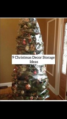 a christmas tree made out of plastic bags and wrapped around it with the words toddler proofing a christmas tree