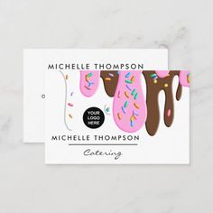 a business card with doughnuts and sprinkles on the front, in white