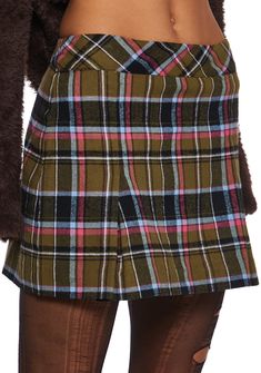 because you're totally unique. This mini skirt has an a-line design, a high rise waist, slits up the front, and a plaid pattern all over. Retro Mini Length Bottoms For Fall, Green Mini Length Fall Skort, Preppy Mini Length Bottoms For Fall, Short Green Skirt For Fall, Green Short Skirt For Fall, Trendy Plaid Mini Skirt For Work, Trendy Plaid Mini Skirt For Winter, Trendy Plaid Skirt For Fall, Preppy Short Mini Skirt For Fall