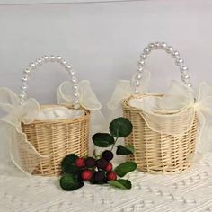 two wicker baskets with bows and berries