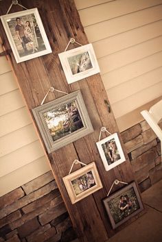 some pictures hanging on a wooden wall