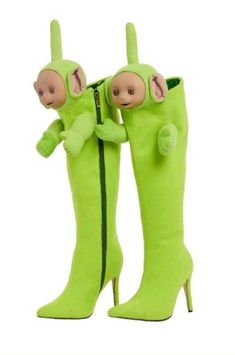 a pair of green boots with monkeys on them