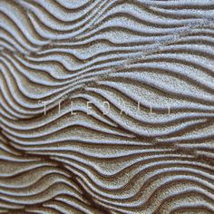 close up view of wavy lines on sand