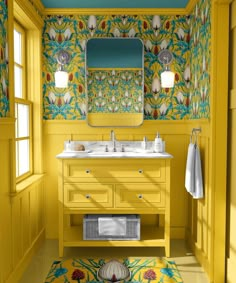 a bathroom with yellow walls and floral wallpaper on the ceiling, along with two sinks