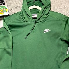 Brand New Nike Hoodie. No Tags, Never Been Worn. Deep Forest Green Color Very Comfortable. Size Small. Green Sporty Hoodie With Ribbed Cuffs, Nike Green Athleisure Hoodie, Green Sportswear Hoodie With Ribbed Cuffs, Green Fleece Athleisure Hoodie, Green Hoodie With Kangaroo Pocket For Sports, Green Fleece Hoodie In Athleisure Style, Sporty Green Sweatshirt With Kangaroo Pocket, Green Athleisure Sweatshirt With Kangaroo Pocket, Nike Green Fleece Tops