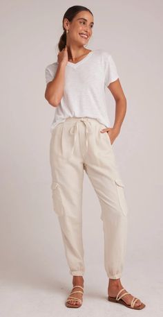 Introducing our versatile Isla Pleated Jogger, designed for both style and comfort, these pants are perfect for everyday wear, offering a comfortable fit that can be worn anywhere. Upgrade your wardrobe with these must-have cargo pants that combine fashion and practicality effortlessly. 50% Cotton 25% Tencel 25% Linen. Relaxed Fit Cargo Style Joggers For Loungewear, Linen Cargo-style Bottoms, Relaxed Fit Linen Cargo Bottoms, Relaxed Fit Linen Cargo Style Bottoms, Elevated Casual Straight Cargo Pants With Elastic Waistband, Everyday Cream Bottoms With Elastic Waistband, Versatile Cargo Loungewear Pants, Versatile Cargo Pocket Loungewear Pants, Casual Cream Pants For Everyday