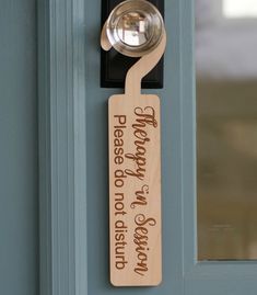 a door hanger with a bell on it that says, please to reason no one is present