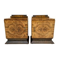 a pair of wooden chests sitting next to each other on top of a white background