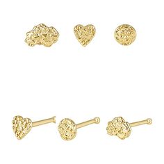 three pairs of gold heart shaped studs and two hearts on each ear, one in the