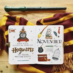 an open harry potter notebook sitting on top of a wooden table next to a pen