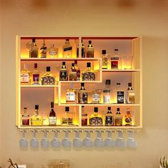 a shelf filled with lots of bottles and glasses