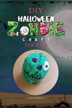 a green ball with googly eyes sitting on top of a wooden table next to the words diy halloween zombie craft for kids