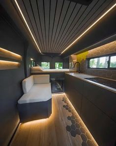 the interior of a modern home with wood flooring