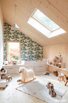 a room with wooden floors and walls covered in wallpaper