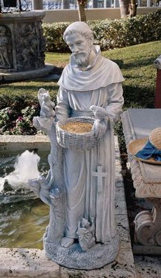 a statue of a man holding a basket next to a fountain