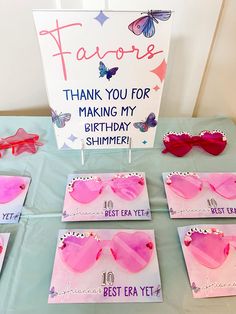 some pink sunglasses are on display at a birthday party for someone's best friend