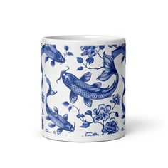 a blue and white mug with fish on it